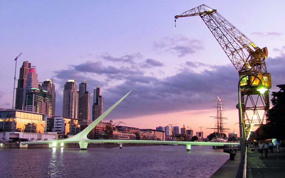 The Puente de la Mujer footbridge over the docks at Puerto Madero, Buenos Aires, at sunset