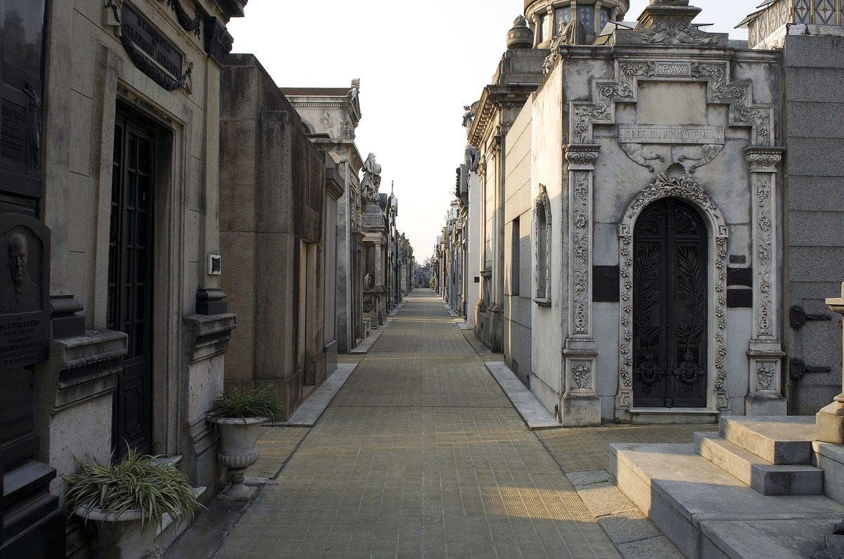 Marble mausoleums lining a narrow avenue in Recoleta Cemetery, Buenos Aires