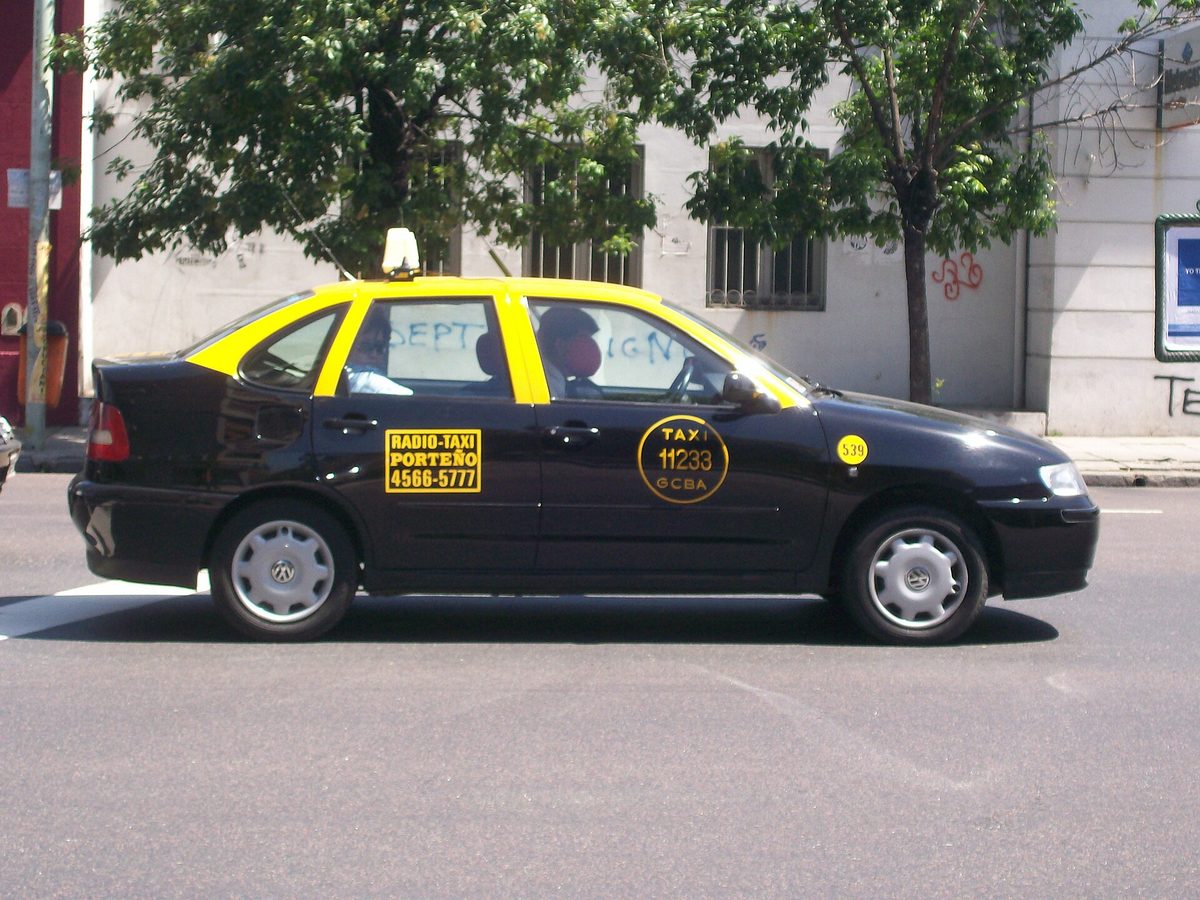 Black-and-yellow porteno radio-taxi in Buenos Aires, a quick ride from Aeroparque into the city