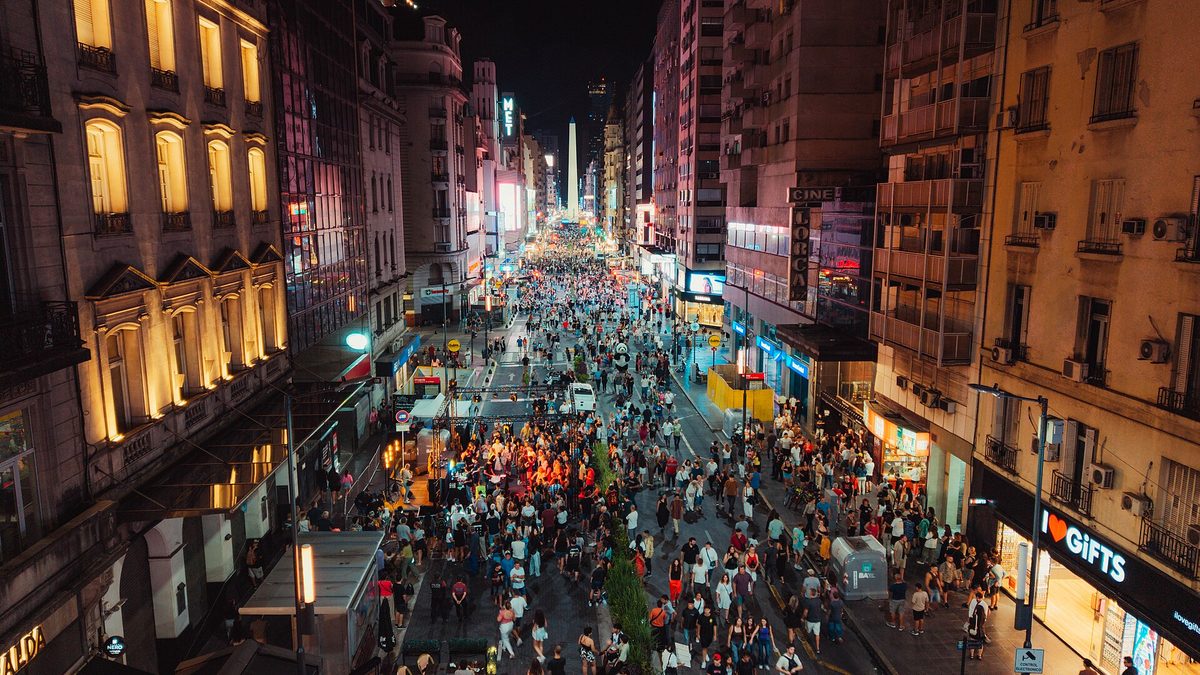Avenida Corrientes lit up at night near the Obelisco, the avenue that runs through Villa Crespo