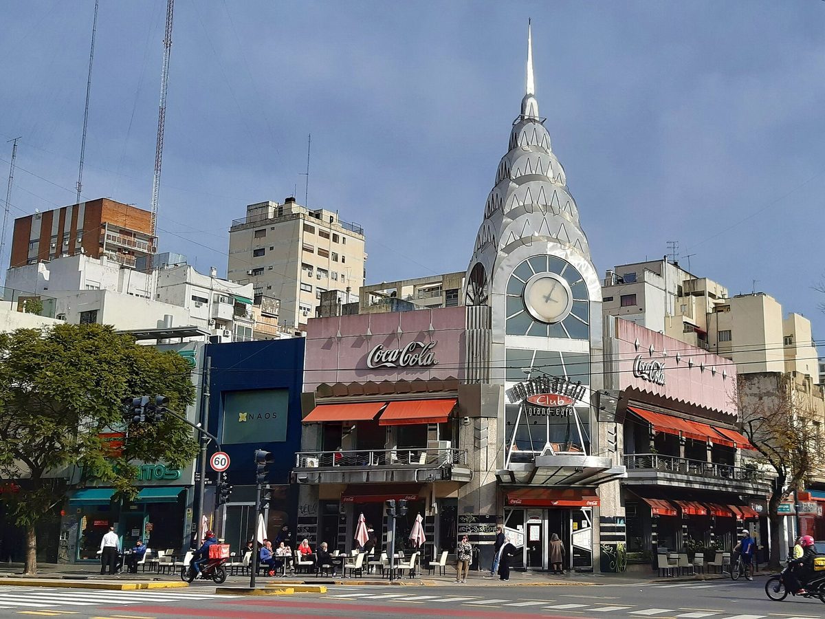A busy street corner with cafes and apartment buildings in the Belgrano district of Buenos Aires