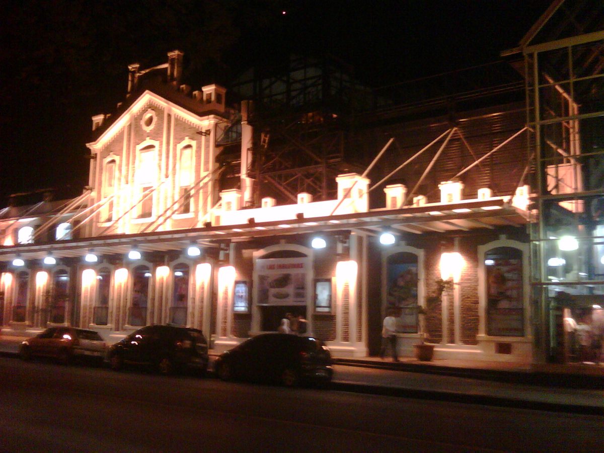 A floodlit historic building on a Buenos Aires street at night