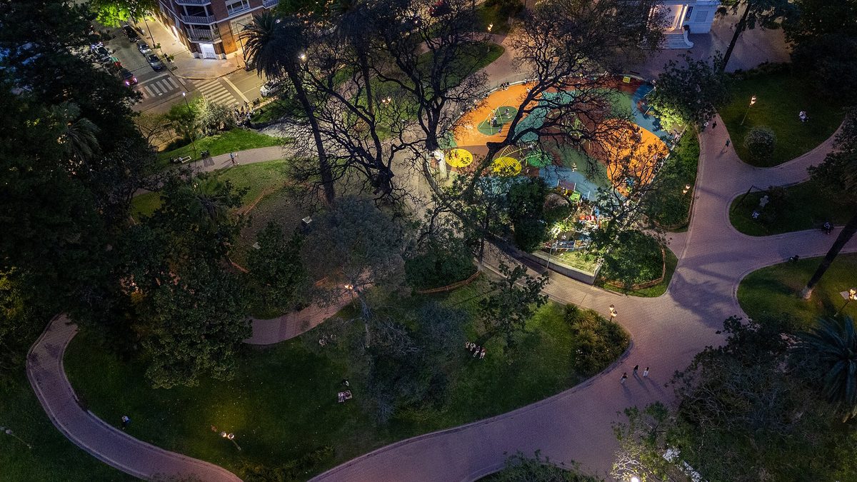 An illuminated playground among the trees at Barrancas de Belgrano park in the residential Belgrano barrio of Buenos Aires