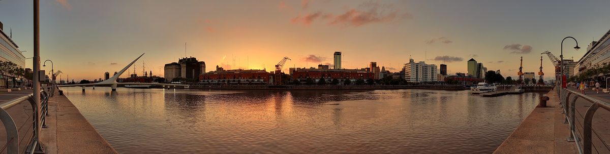 Puerto Madero waterfront and the Puente de la Mujer at sunset in Buenos Aires, a breezy riverside walk in summer