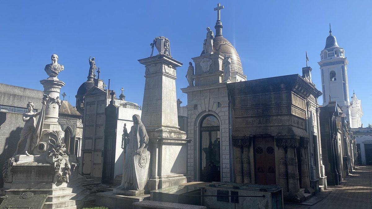 Marble mausoleums at Recoleta Cemetery on a clear winter day in Buenos Aires