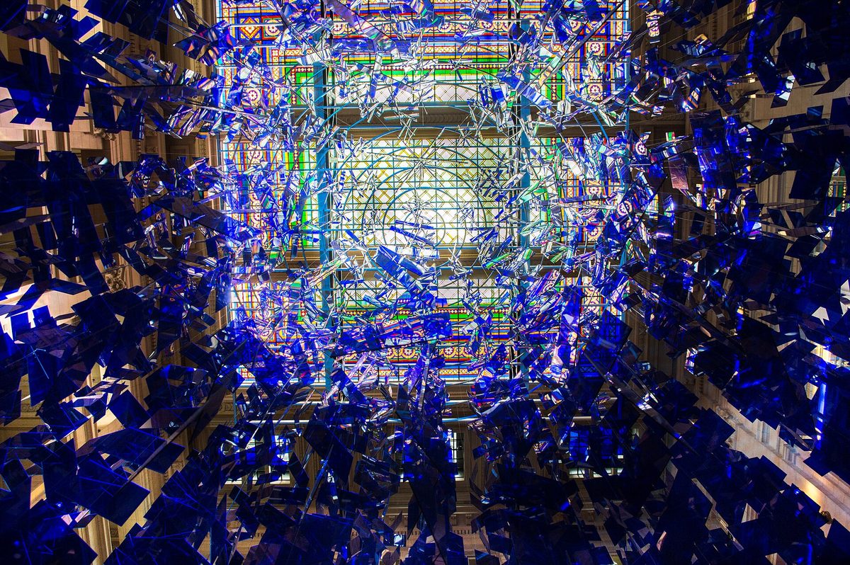 The blue acrylic sphere and stained-glass dome inside the CCK / Palacio Libertad in Buenos Aires