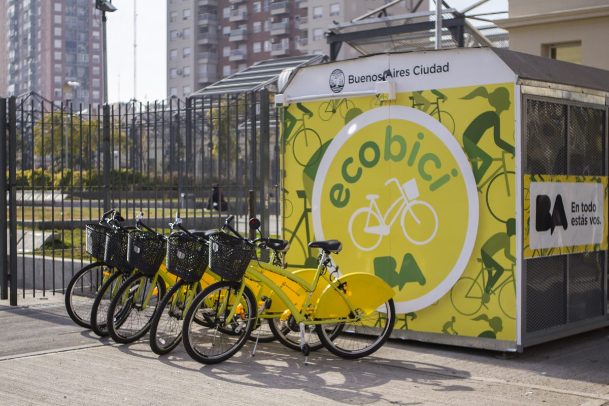 Yellow EcoBici public share bikes docked at a station, a key way to start cycling in buenos aires