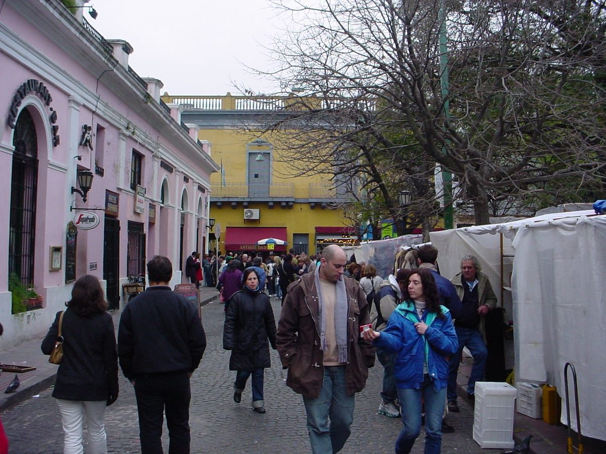 White-tent stalls of antiques and crafts crowding the Feria de San Telmo on a Sunday in Buenos Aires