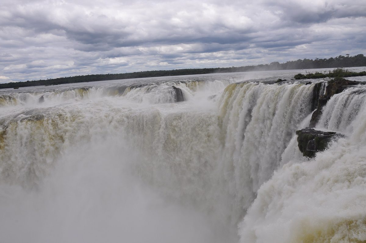The Garganta del Diablo (Devil's Throat) of Iguazu Falls with churning water and rising mist on the Argentine side