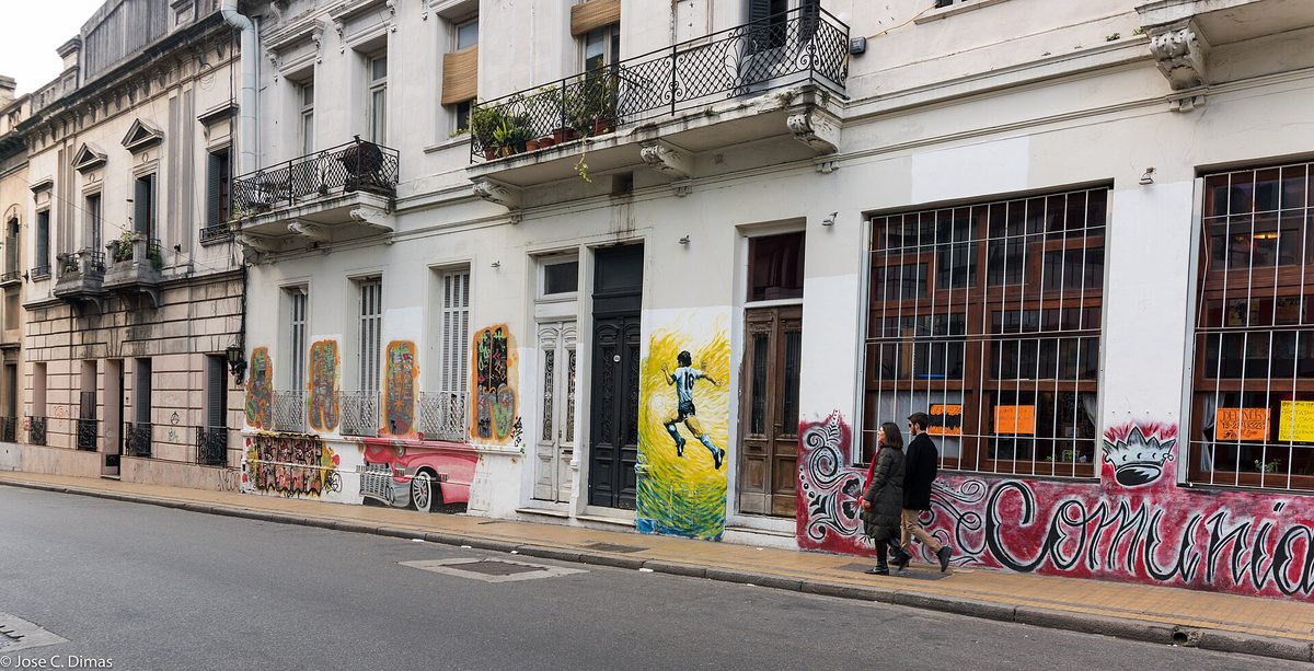 A colorful street mural of Diego Maradona, a common sight across Buenos Aires