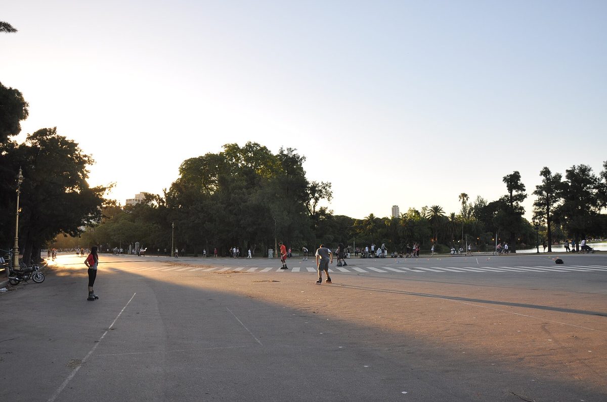 Roller-skaters on the wide promenades of the Bosques de Palermo at golden hour, Buenos Aires