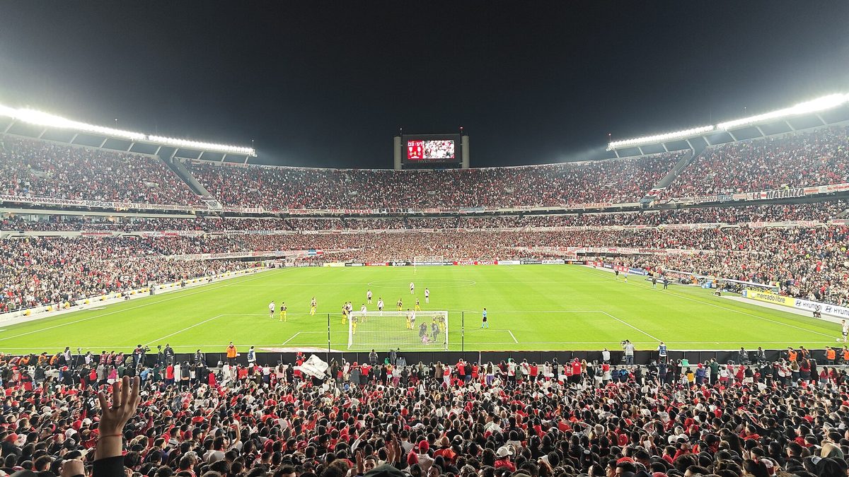 A packed Estadio Monumental at night during a River Plate match