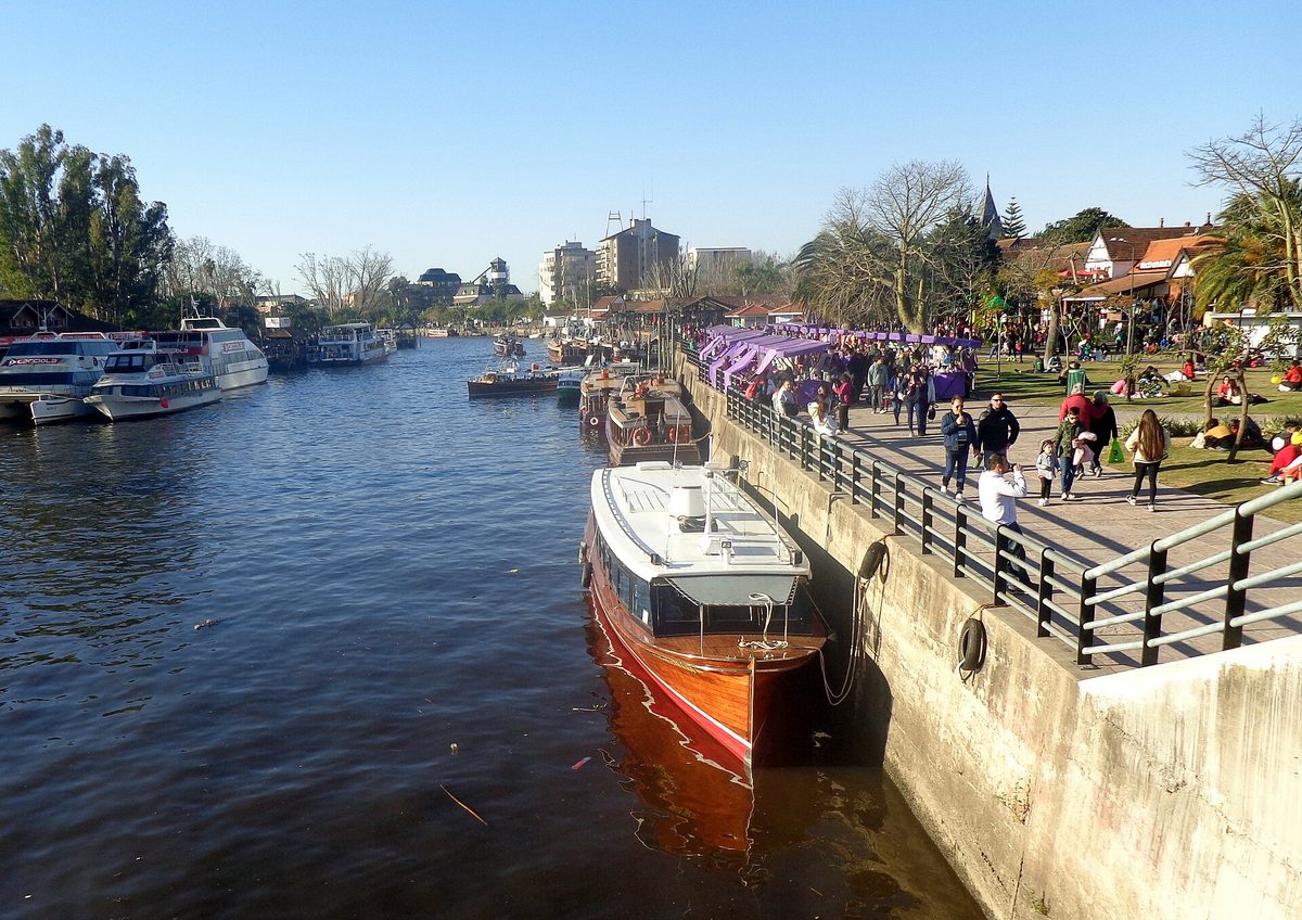 Tour boats and commuter lanchas moored along the busy waterfront promenade by the Estación Fluvial in Tigre