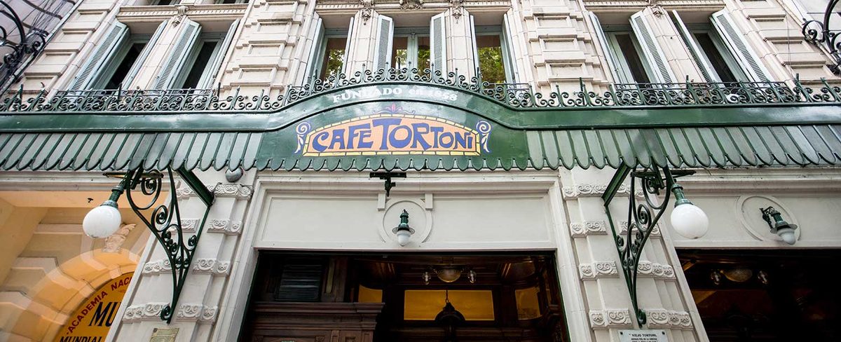 The ornate facade of the historic Cafe Tortoni in Buenos Aires, a classic cafe where a small tip is appreciated