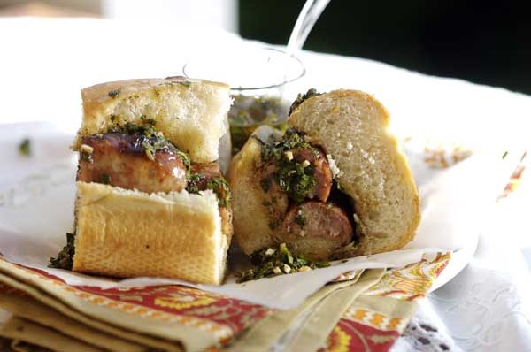Choripan, a grilled chorizo sandwich with chimichurri, a classic Buenos Aires street food
